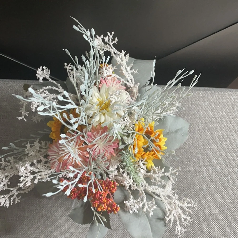 Dried faux flowers in white squat‎ pot decor